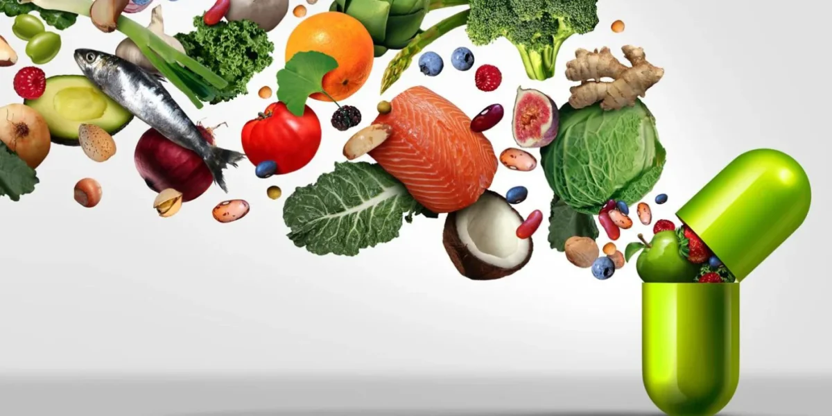 Foods flowing into an open green capsule